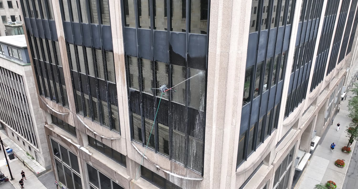 The hose links the drone to the ground, the street below
