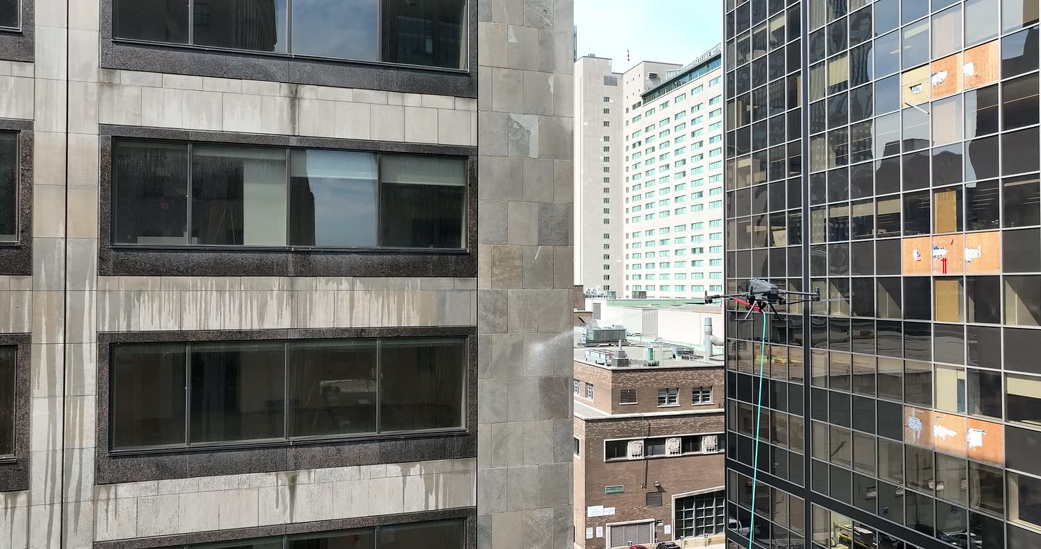 The drone works metres from the neighbouring tower