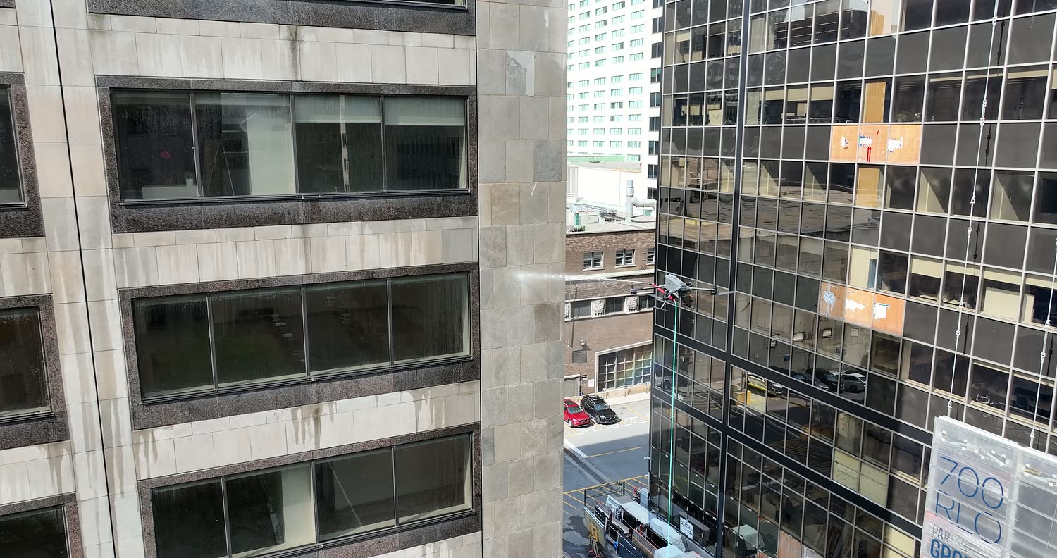 The drone moving in between two towers